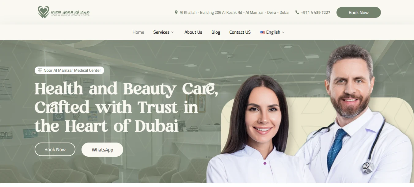 Noor Al Mamzar Medical Center homepage hero: Health and Beauty Care, Crafted with Trust in the Heart of Dubai, with Book Now and WhatsApp buttons over a reception photo, and doctor and nurse portraits anchoring the bottom